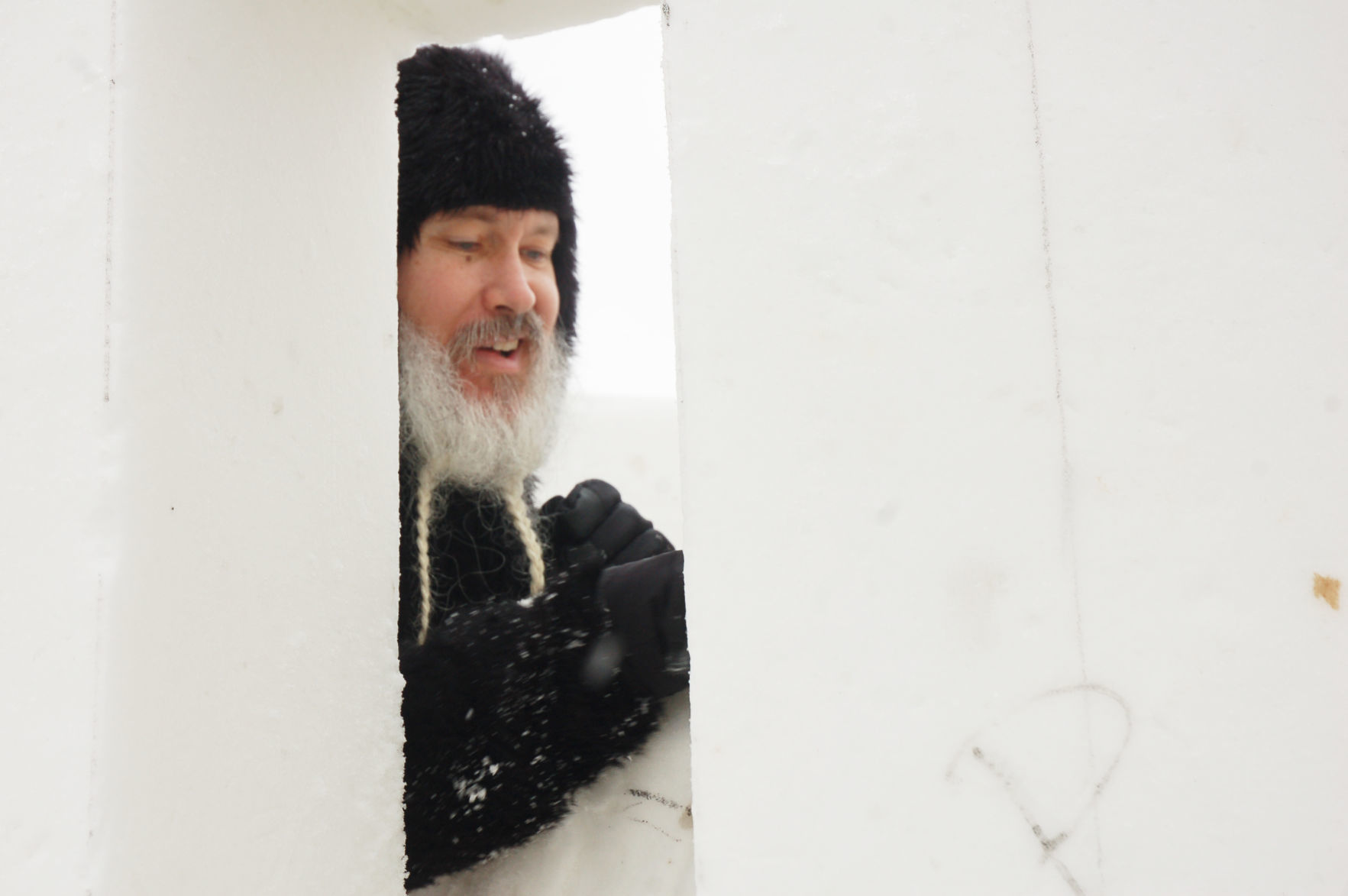 Snow sculptor 'Man Bear' deep inside snow cylinder